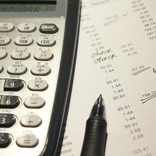 tax filing paperwork with calculator